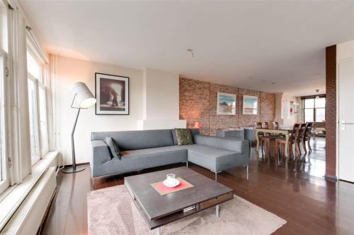 a living room with a couch and a table at Loft in Lower Nob Hill in San Francisco