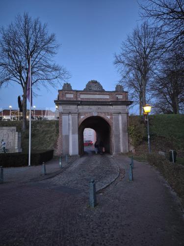 a bridge over a road with a tunnel at Studio Zebra in Heikant