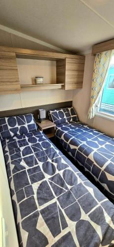 a room with two beds in a room at Sea view 1 in Heysham