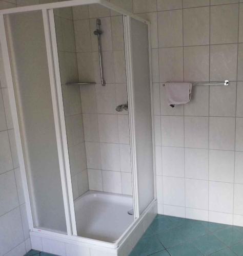 a shower with a glass door in a bathroom at Apartment Sayda 4 in Sayda