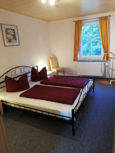 a bedroom with a large bed and a window at Apartment Sayda 4 in Sayda