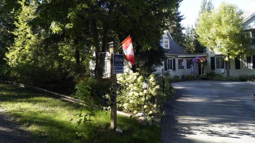 a street sign in front of a house at The Inn at the Ninth Hole Bed & Breakfast in Salmon Arm