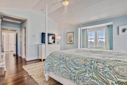a bedroom with a large bed and a window at Frankly My Dear - Duck, Oceanfront, Elevator, Wheelchair Friendly, Pool Table, Pool, Hot Tub, Flex Stays in Duck