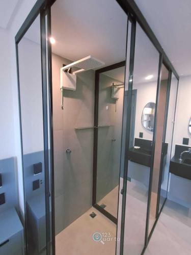 a glass shower in a room with a sink at Get Sense By 123Quarto Hospedagem in João Pessoa