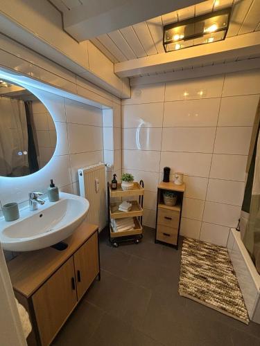 a bathroom with a sink and a mirror at 115 qm Apartment für bis zu 8 Personen mit 4 Schlafzimmern in Lünen