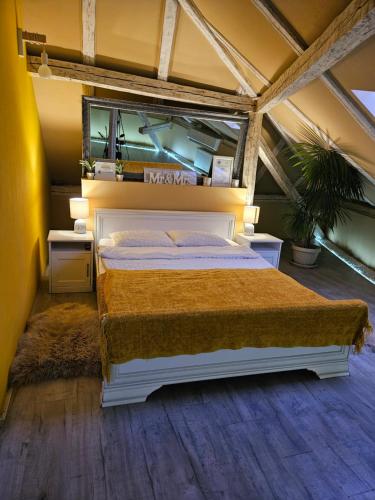 a bedroom with a large bed in a tent at Laci Lak in Oradea