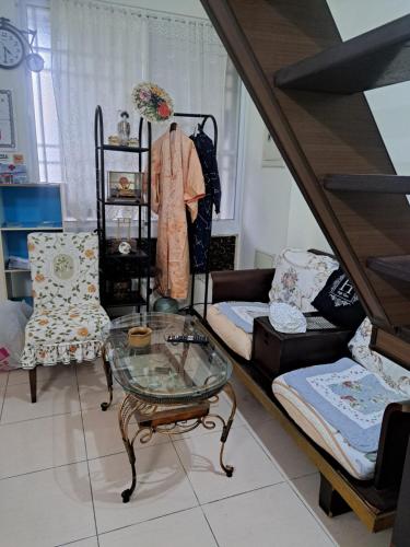 a living room with a couch and a glass table at 包棟Linsen Secret Realm 27 in Tainan