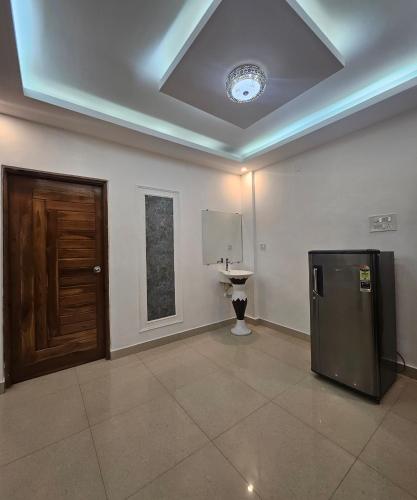 a room with a refrigerator and a toilet in it at Villa platinum 4 Bhk in Calangute