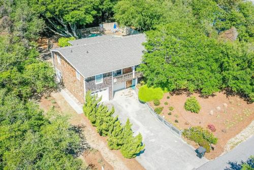an overhead view of a brick building with trees at Seascape Cottage - Kitty Hawk, MP 3.5, 300 Yds to Beach, Pool, Foosball, Near Golf Course, Flex Stays in Kitty Hawk