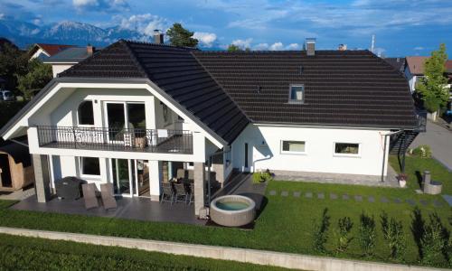 a rendering of a house with a roof at Hiša Helena in Kranj