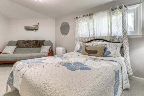 a bedroom with a bed and a couch at Riverfront Savannah Getaway w/ Pool & Dock! in Savannah