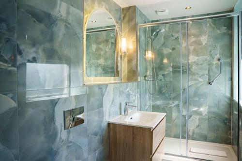 a bathroom with a sink and a shower at The Parliament House Hotel in Edinburgh