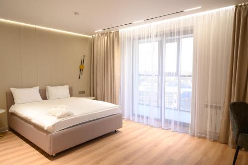 เตียงในห้องที่ Rakhat Hotel