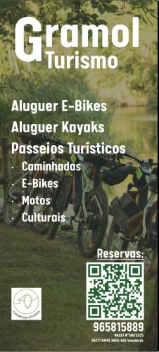 a poster of a motorcycle parked in the grass at NATURE e SPA AL - Termas Saúde e Beleza, Totalmente Renovado - Piscinas Municipais em frente - Epoca Julho a Setembro in São Pedro do Sul