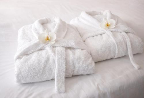 Giường trong phòng chung tại Casetta Robinie