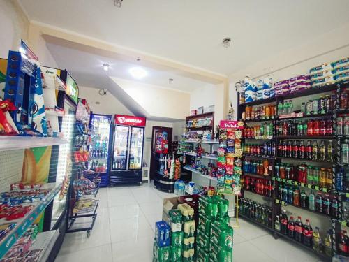 a store aisle of a grocery store with drinks at Hospedaje ALETHIA in Huacho