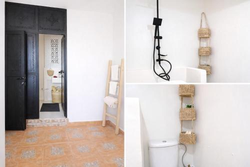 a room with a toilet and a black door at Adrar Lodge - Boutique Guesthouse with Sea View in Tamraght Ouzdar