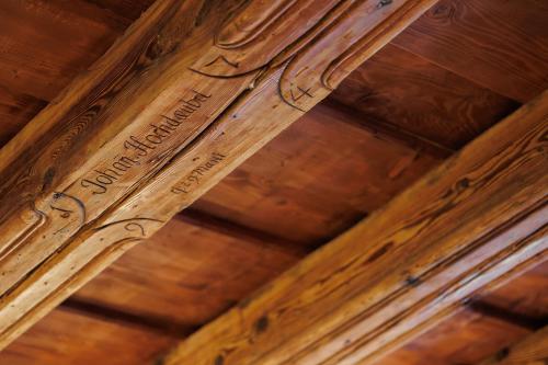 a wooden ceiling with writing on the ceiling at Schloss Haus Boutique in Braşov