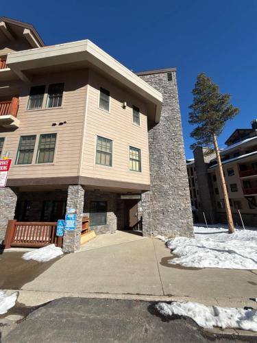 a large building with a tree in front of it at Family Ski Getaway in Kirkwood