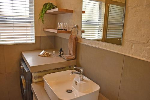 a bathroom with a sink and a mirror at 1001 Pont de Val in Parys
