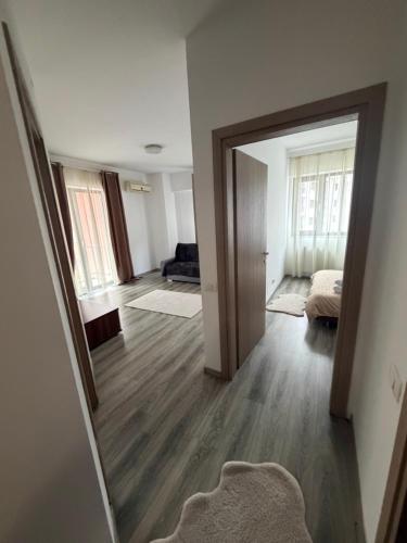 a room with a mirror and a living room at Resident aparments two bed with balcony in Bucharest