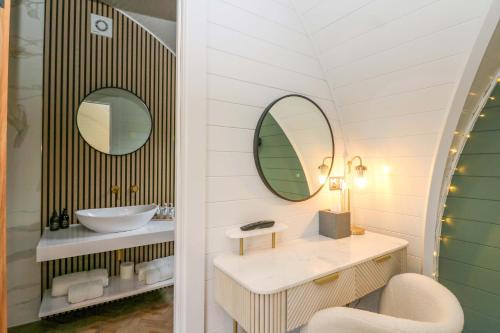 a bathroom with a sink and a mirror at Crofters Suite in Acharacle