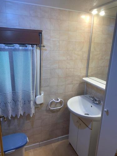 a bathroom with a sink and a mirror at Rancho Catalan 2 in Castillo de Aro