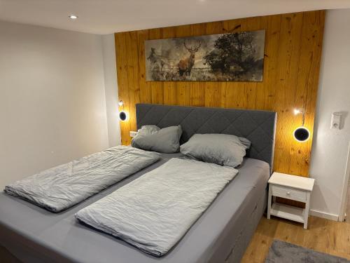a bed with two pillows on it in a bedroom at Apartment am Grimmsteig in Nieste