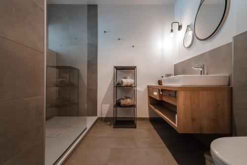 a bathroom with a sink and a mirror at Valavier Aktivresort in Brand