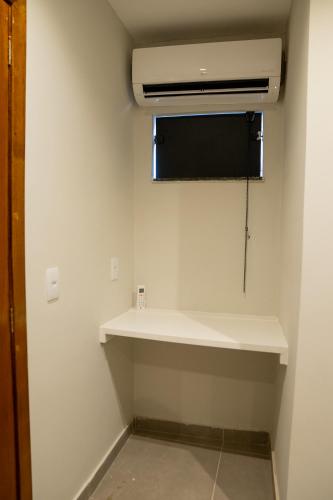 a room with a air conditioner on a wall at Favela Hostel in Rio de Janeiro