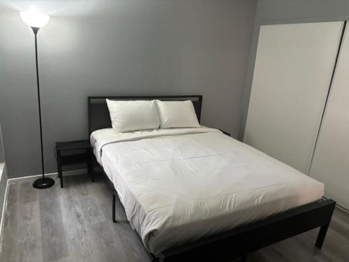 a bed with two pillows on it in a room at 2 or 3 Bedroom Extended Stay Walk to Strip MGM Casino Shop Club in Las Vegas