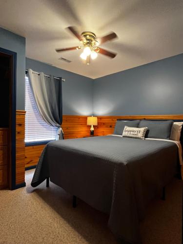 a bedroom with a bed and a ceiling fan at Papa Chubbys RV Resort in Sunrise Beach