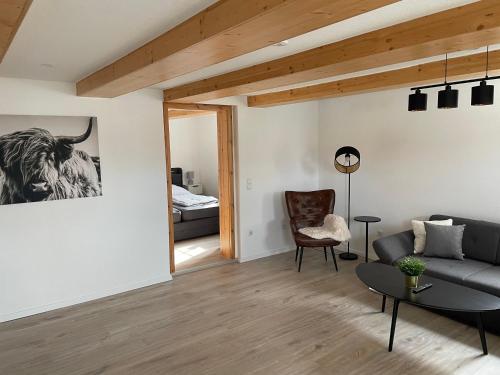 a living room with a couch and a bed at Ferienwohnung Holtensen in Göttingen