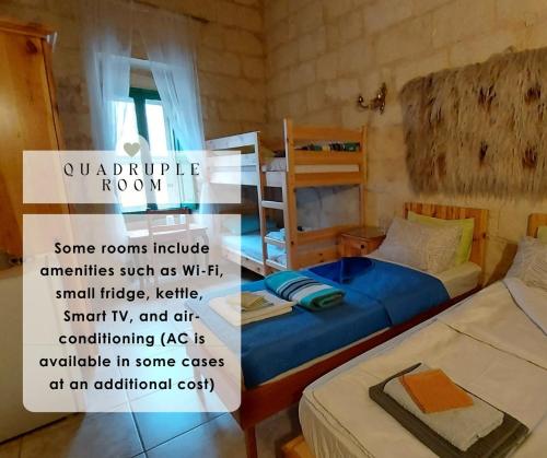 a room with two beds and a sign in it at HAPPY and HEALTHY GOZO, Self-Check-in HOUSE in Victoria