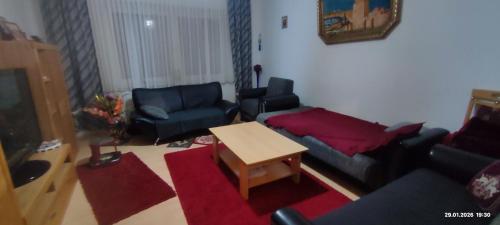 a living room with a couch and chairs and a table at Wohnung in der Ruhr Witten in Witten