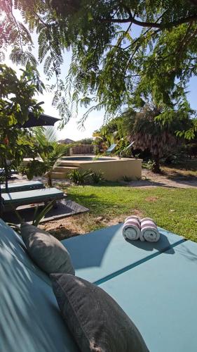 a pair of slippers sitting on a table in a yard at Vila das Águas in Atins