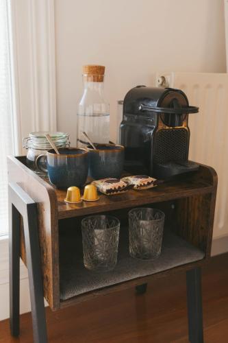 a table with bowls and dishes on top at Habitación en vivienda compartida con baño privado in Santullán