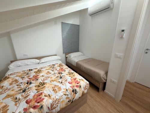 a small bedroom with a bed and a window at B&B Sant'Angelo Sala Consilina in Sala Consilina
