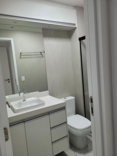 a bathroom with a sink and a toilet at Cais Eco Residência in Ipojuca