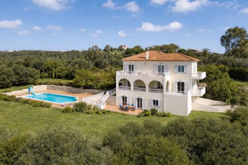 an aerial view of a house with a swimming pool at Villa Aether Methoni in Methoni