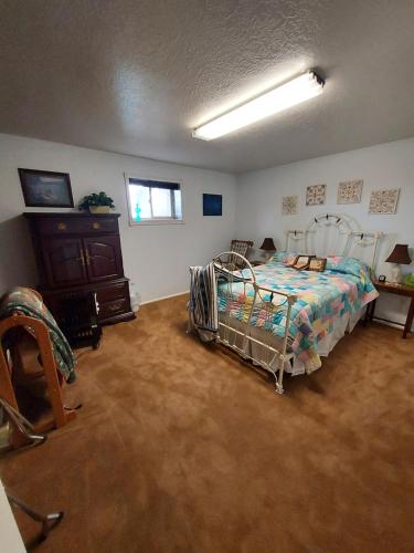 a bedroom with a bed and a dresser in it at Beautiful Country Location in Harrisville