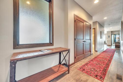 a hallway with a wooden table and a red rug at Bridges Bay Resort Brooklyn Building 308 in Arnolds Park