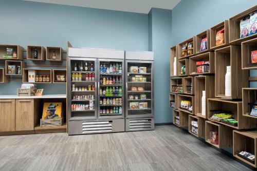 a pharmacy aisle with two refrigerators and shelves at Element by Marriott Sedona in Sedona