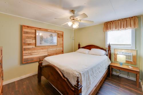 a bedroom with a bed and a ceiling fan at Lake Views + Dock Access: Georgetown Group Getaway in Georgetown