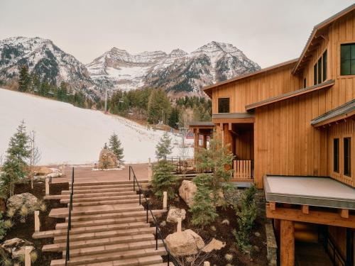 a stairway leading to a building with mountains in the background at Sundance Mountain Resort in Sundance