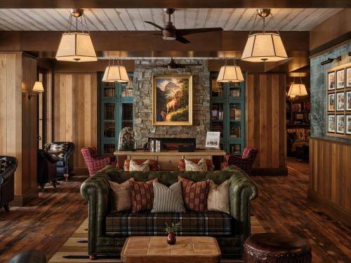 a living room with a couch and a fireplace at Sundance Mountain Resort in Sundance