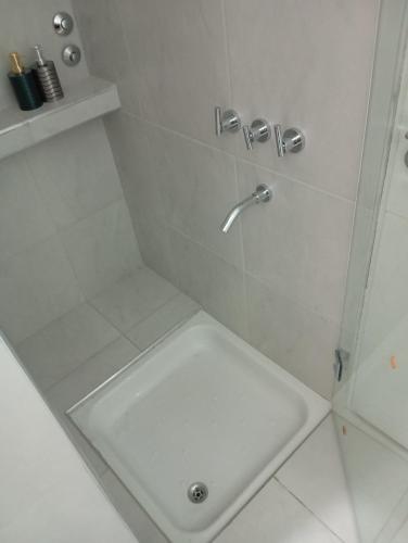 a bathroom with a shower with a sink at Panchitas in Guaymallen