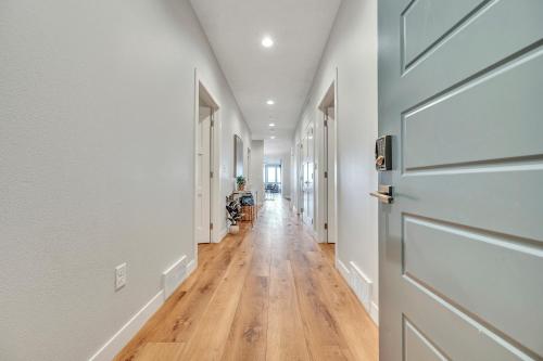 a hallway with a door and a hard wood floor at Stillwater 113 in Arnolds Park