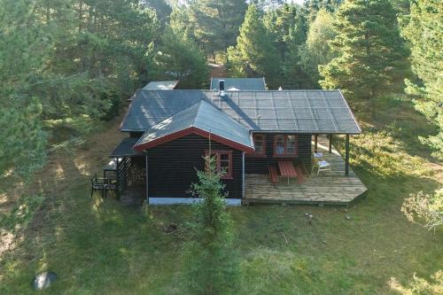 an aerial view of a cabin in the woods at Authentic Summerhouse Near The Beach in Rørvig