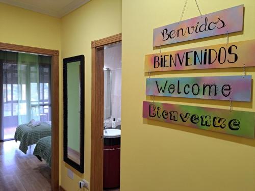 a room with signs on the wall of a bedroom at Suseia in Arcade